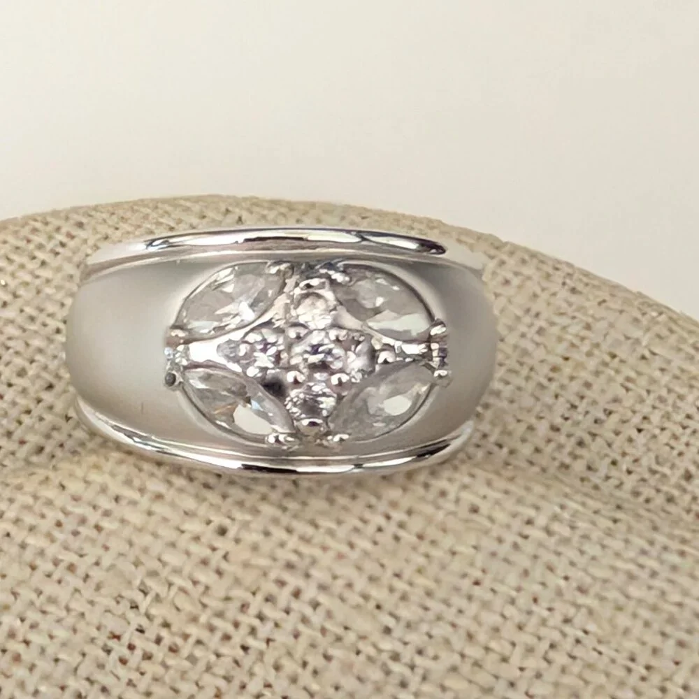 Matte brushed silver tone and faux diamond wide band ring